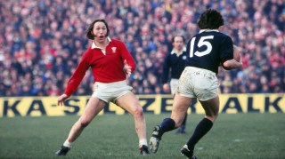 Williams prepares to tackle Scotland’s Andy Irvine during an 18-9 Wales win in the 1977 Five Nations at Murrayfield