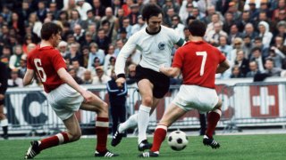 Beckenbauer runs with the ball against the Soviet Union in West Germany’s victorious 1972 European Championship final